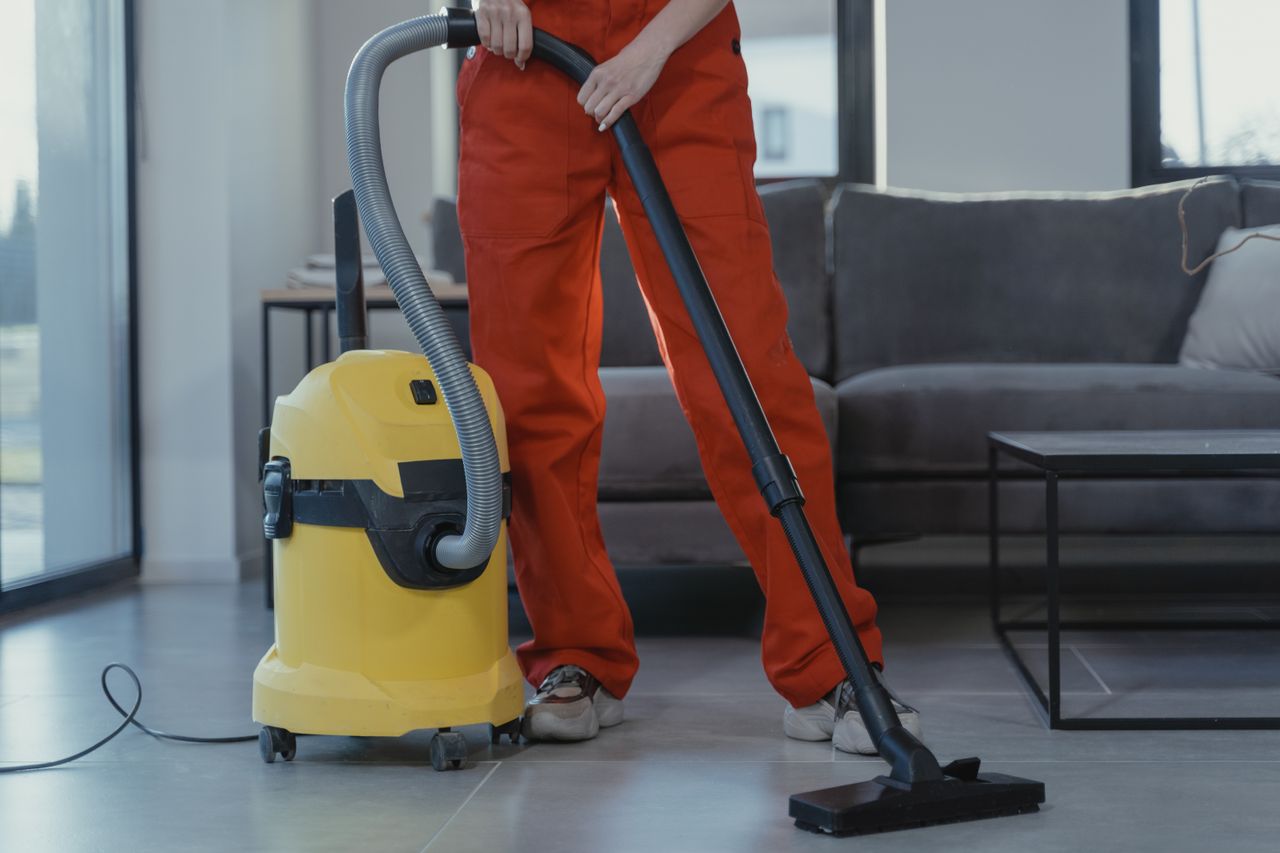 A professional cleaner servicing an office floor